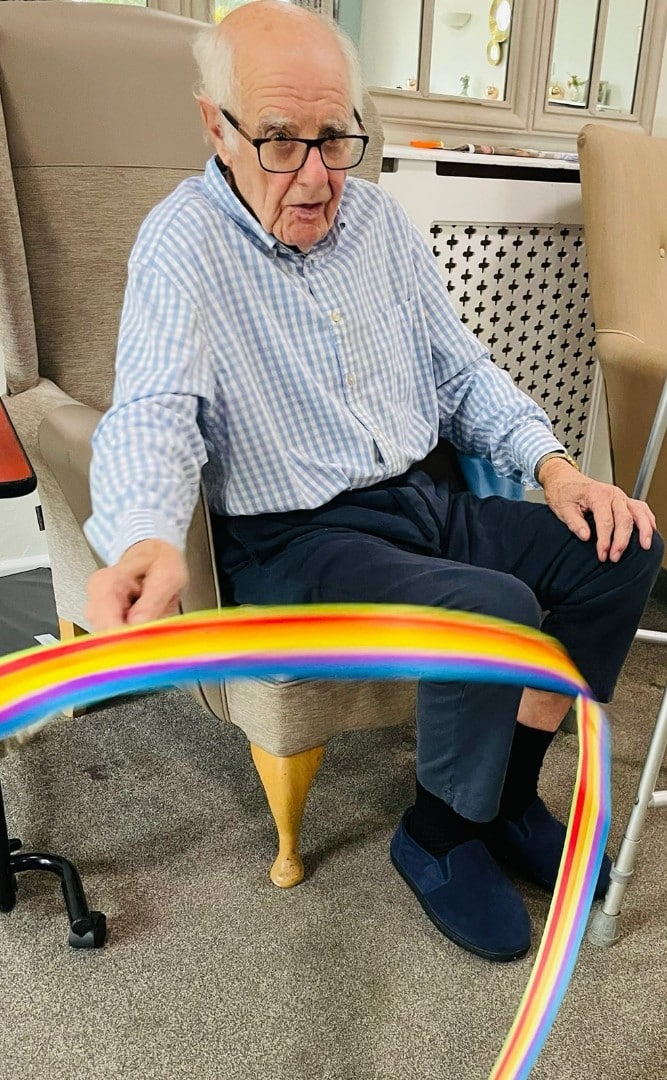 A resident enjoying an activity of movement at Court House Care Home in Malvern