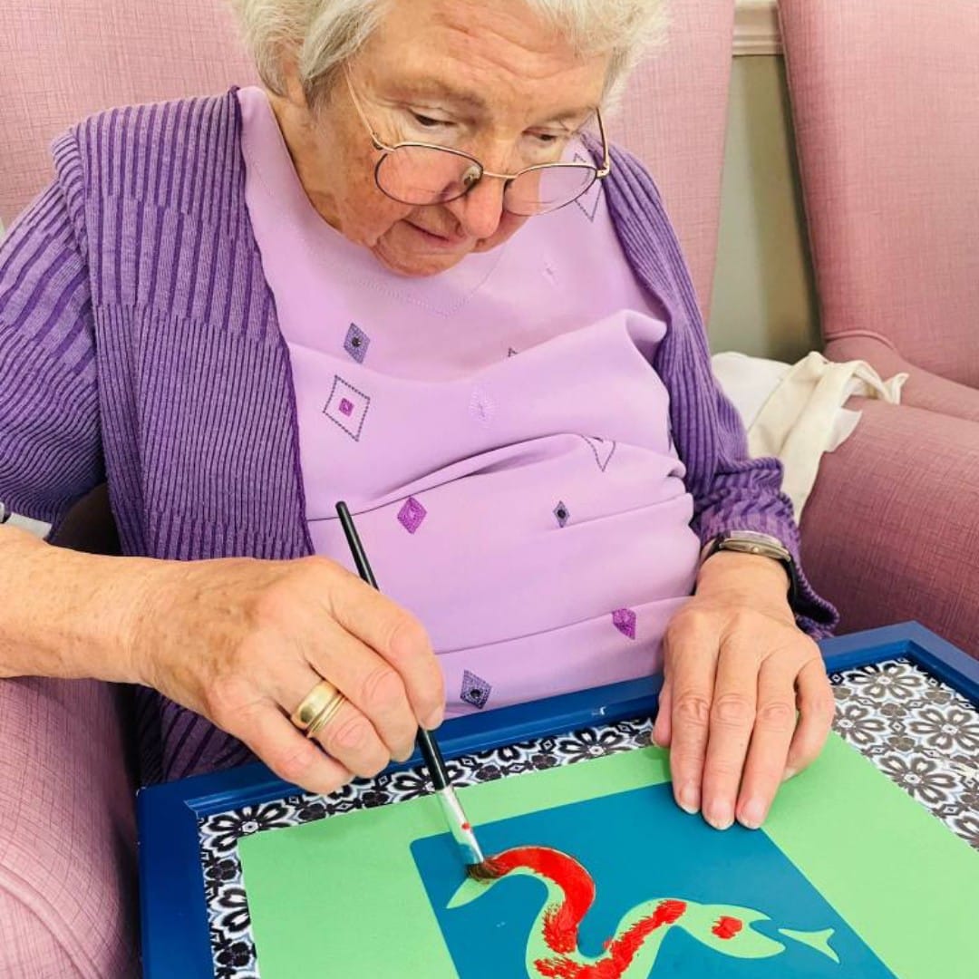 Court House Care resident enjoying some craft